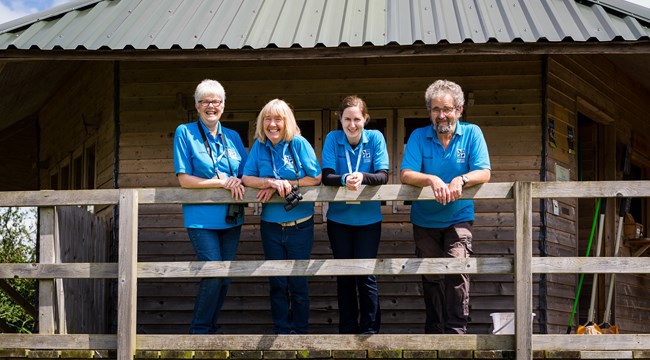 Volunteer's standing on the Discovery hut